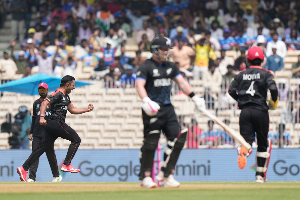 Canada's Saad Bin Zafar, left, celebrates the wicket of New Zealand's Tim Seifert during the T20 World Cup cricket match between Canada and New Zealand in Chennai, India, Tuesday, Feb. 17, 2026. (AP Photo/Mahesh Kumar A.)