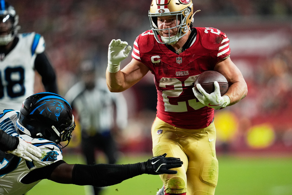 San Francisco 49ers running back Christian McCaffrey runs for a touchdown against the Carolina Panthers during the second half an NFL football game, Monday, Nov. 24, 2025, in Santa Clara, Calif. (AP Photo/Godofredo A. Vásquez)