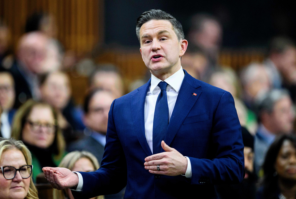 Conservative Leader Pierre Poilievre stands in the House of Commons during Question Period on Parliament Hill in Ottawa, Canada, Thursday, Dec. 11, 2025. (Spencer Colby/The Canadian Press via AP)