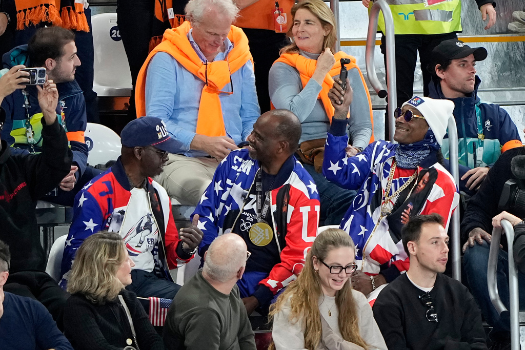 Snoop Dog watches the women's 500 meters speedskating race at the 2026 Winter Olympics, in Milan, Italy, Sunday, Feb. 15, 2026. (AP Photo/Ben Curtis)