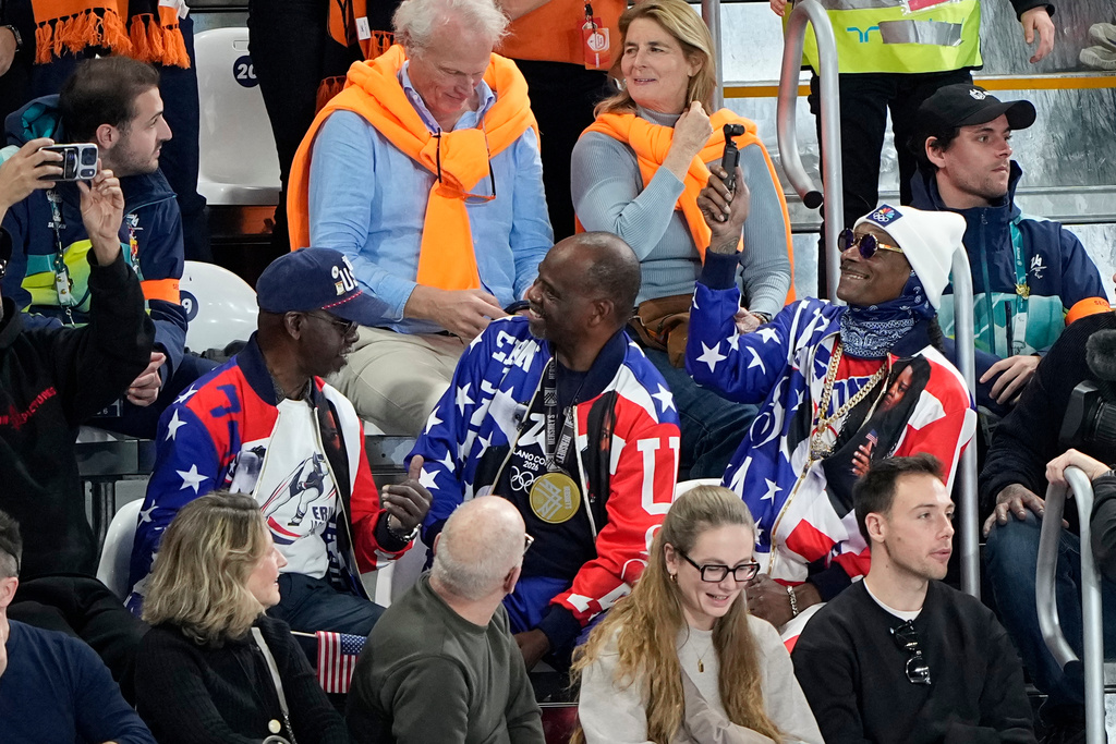 Snoop Dogg watches the women's 500 meters speedskating race at the 2026 Winter Olympics, in Milan, Italy, Sunday, Feb. 15, 2026. (AP Photo/Ben Curtis)