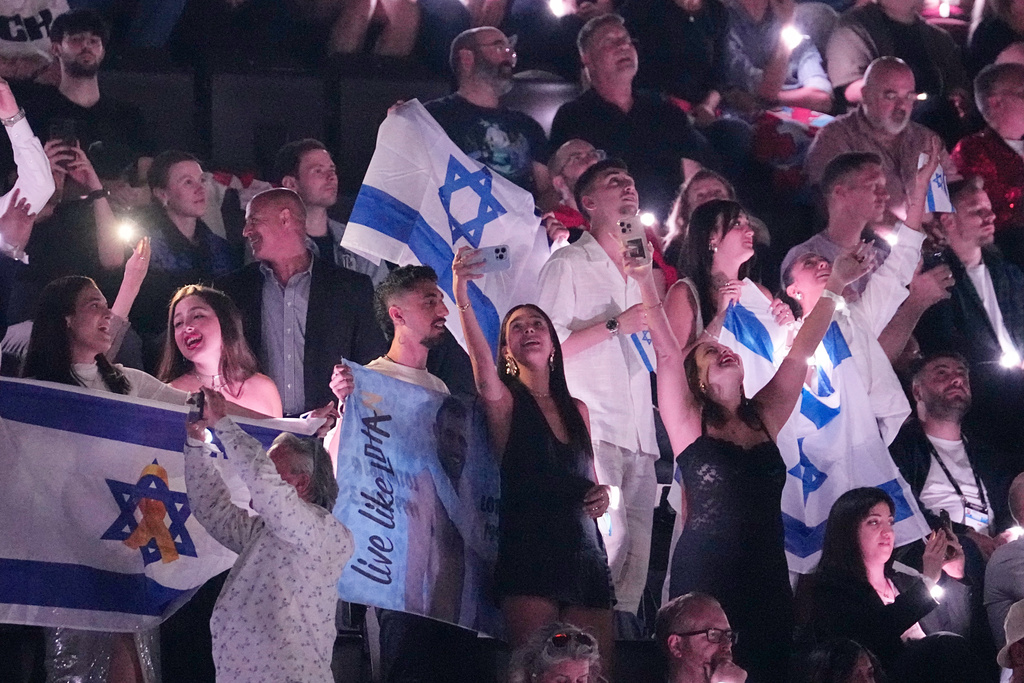 FILE - Israeli fans cheer for Yuval Raphael from Israel after performing during the Semi-Final of the 69th Eurovision Song Contest, in Basel, Switzerland, Thursday, May 15, 2025. (AP Photo/Martin Meissner, File)