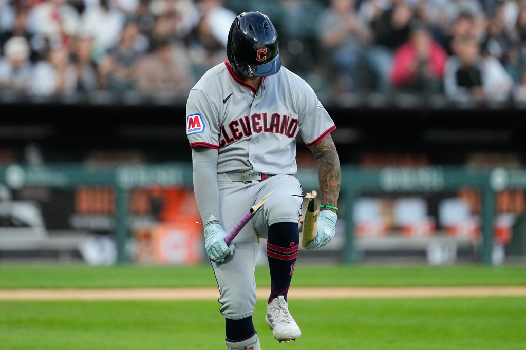 Cleveland Guardians' Brayan Rocchio breaks his bat as he pops out to Chicago White Sox shortstop Luisangel Acuña during the fifth inning of a baseball game in Chicago, Tuesday, June 23, 2026. (AP Photo/Nam Y. Huh)