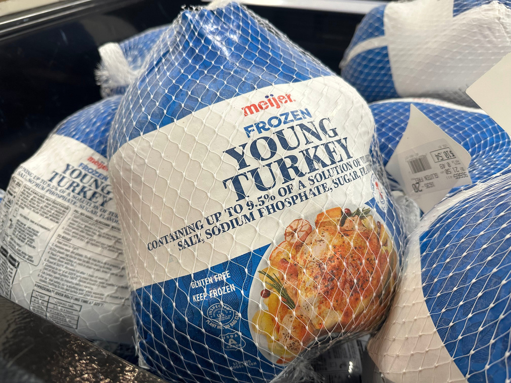 Frozen turkeys are on display at a Meijer store Friday, Nov. 21, 2025, in Canton Township, Mich. (AP Photo/Mike Householder)