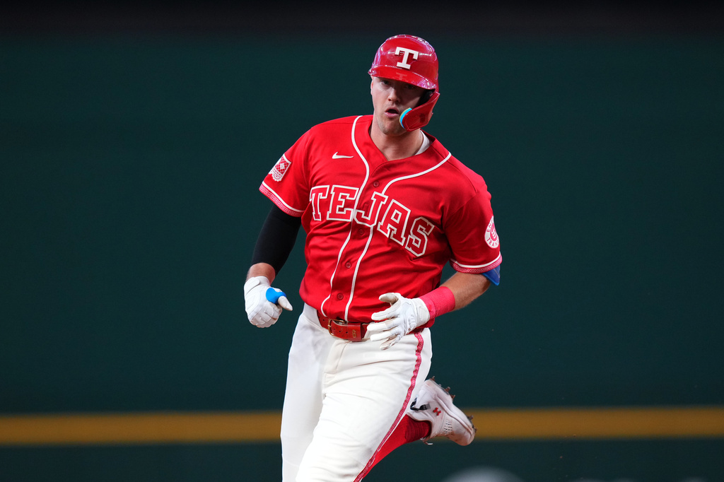 Texas Rangers' Josh Jung runs the bases after hitting a solo home run off Toronto Blue Jays starting pitcher JosÈ Soriano during the first inning of a baseball game Saturday, Sept. 19, 2026, in Arlington, Texas. (AP Photo/Julio Cortez)