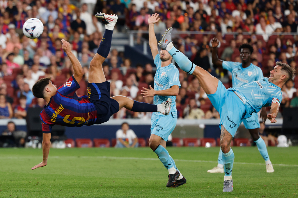 Barcelona's Pau Cubarsi, left, and Athletic Bilbao's Aymeric Laporte challenge for the ball during a Spanish La Liga soccer match between Barcelona and Athletic in Barcelona, Spain, Thursday, Aug. 27, 2026. (AP Photo/Joan Monfort)