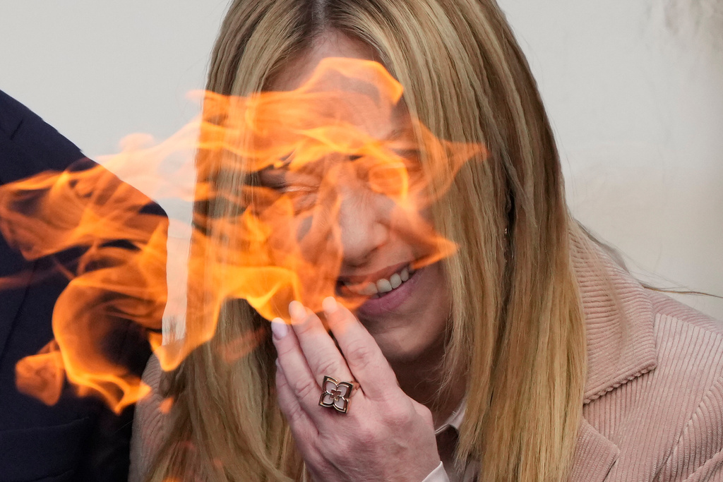 Italy's Prime Minister Giorgia Meloni laughs during the Milan Cortina 2026 Winter Olympics cauldron lighting, in front of the Quirinale Presidential Palace, in Rome, Friday Dec. 5, 2025. (AP Photo/Gregorio Borgia)