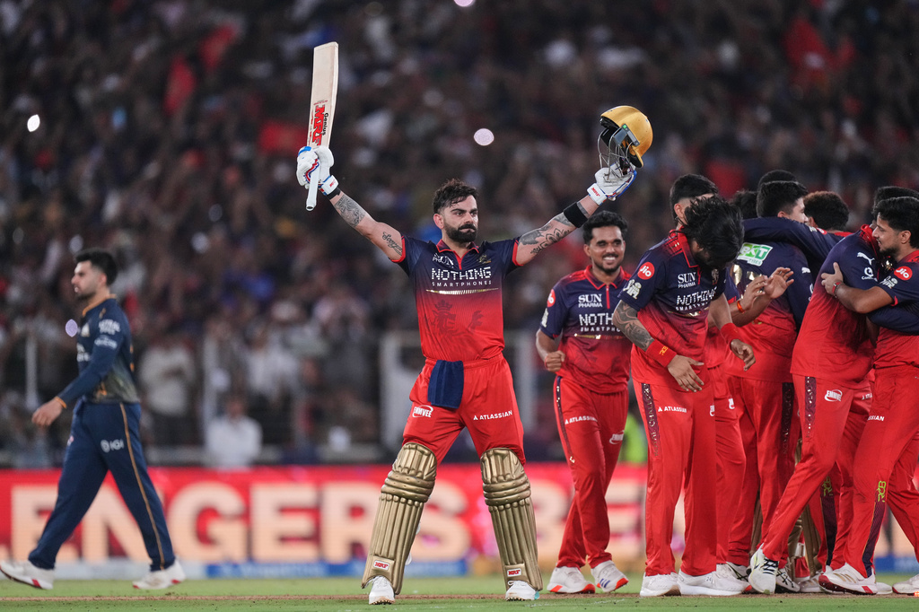 Royal Challengers Bengaluru's Virat Kohli celebrates with teammates after their win in the Indian Premier League final cricket match against Gujarat Titans in Ahmedabad, India, Sunday, May 31, 2026. (AP Photo/Ajit Solanki)