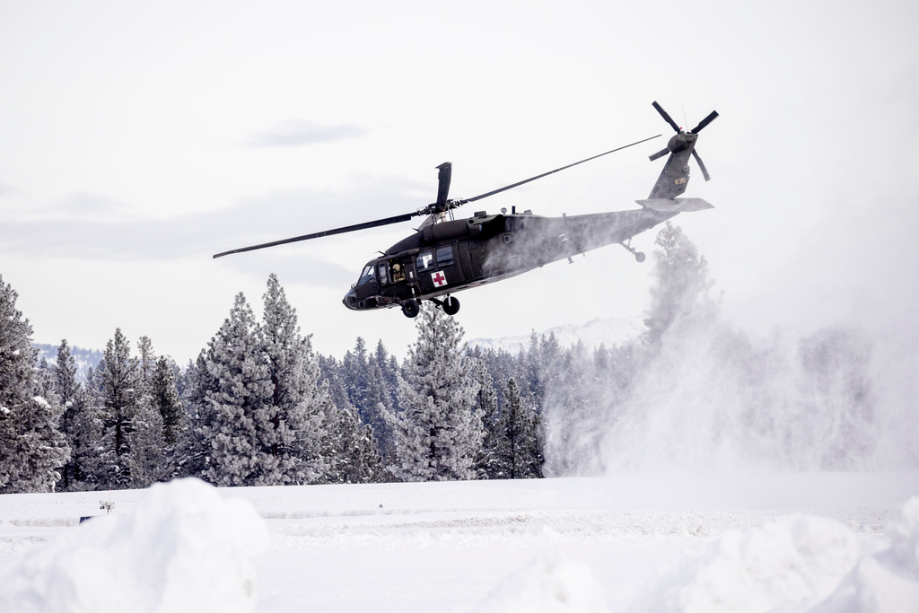 A U.S. Army Blackhawk helicopter lifts off on a mission to recover skiers who died during an avalanche, in Truckee, Calif., Saturday, Feb. 21, 2026. (Stephen Lam/San Francisco Chronicle via AP)
