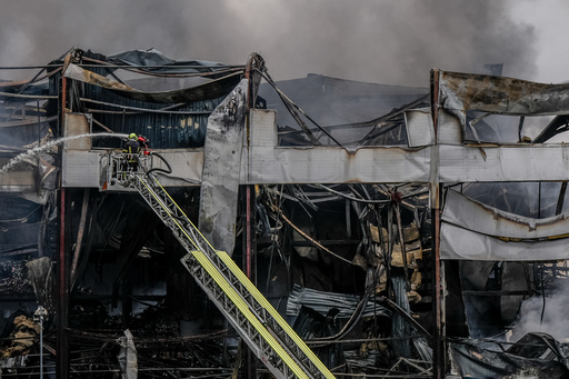 A firefighter works to extinguish a fire at a warehouse following a Russian attack, Saturday, Oct. 25, 2025, in Kyiv, Ukraine. (AP Photo/Julia Demaree Nikhinson) A firefighter works to extinguish a fire at a warehouse following a Russian attack, Saturday, Oct. 25, 2025, in Kyiv, Ukraine. (AP Photo/Julia Demaree Nikhinson)