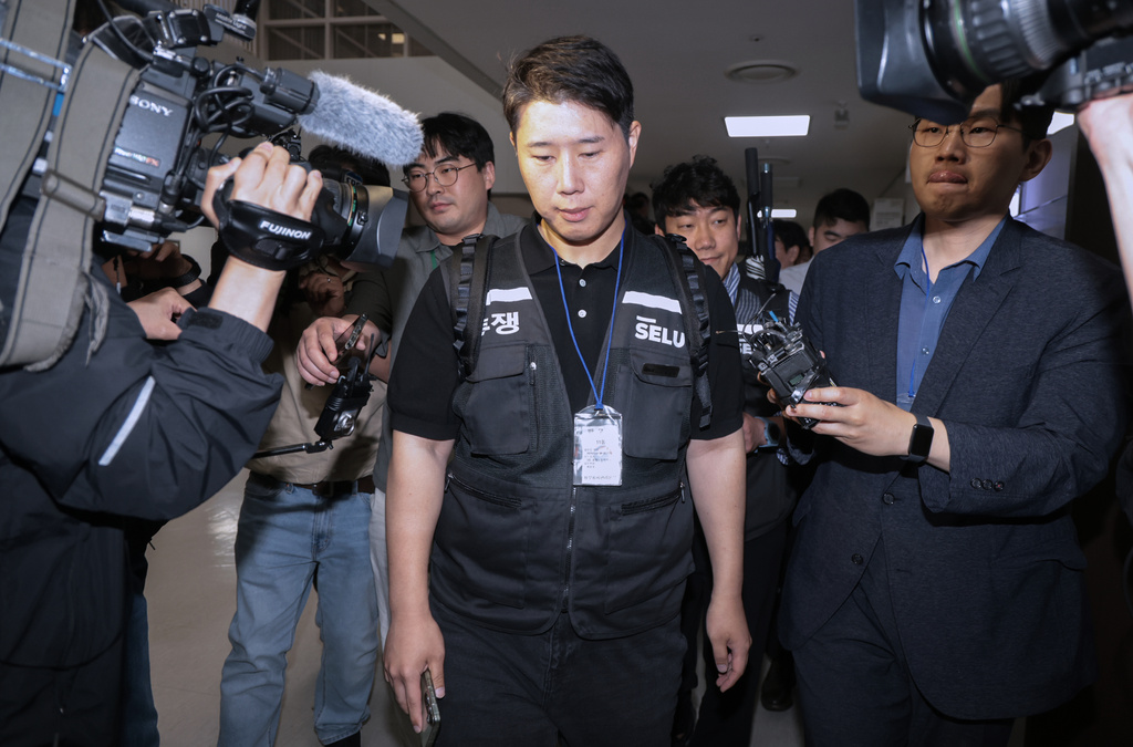 Choi Seung-ho, a leader of the Samsung Electronics labor union, leaves after attending the government-led mediation talks with management at the National Labor Relations Commission office in Sejong, South Korea, Wednesday, May 20, 2026 (Yonhap via AP)