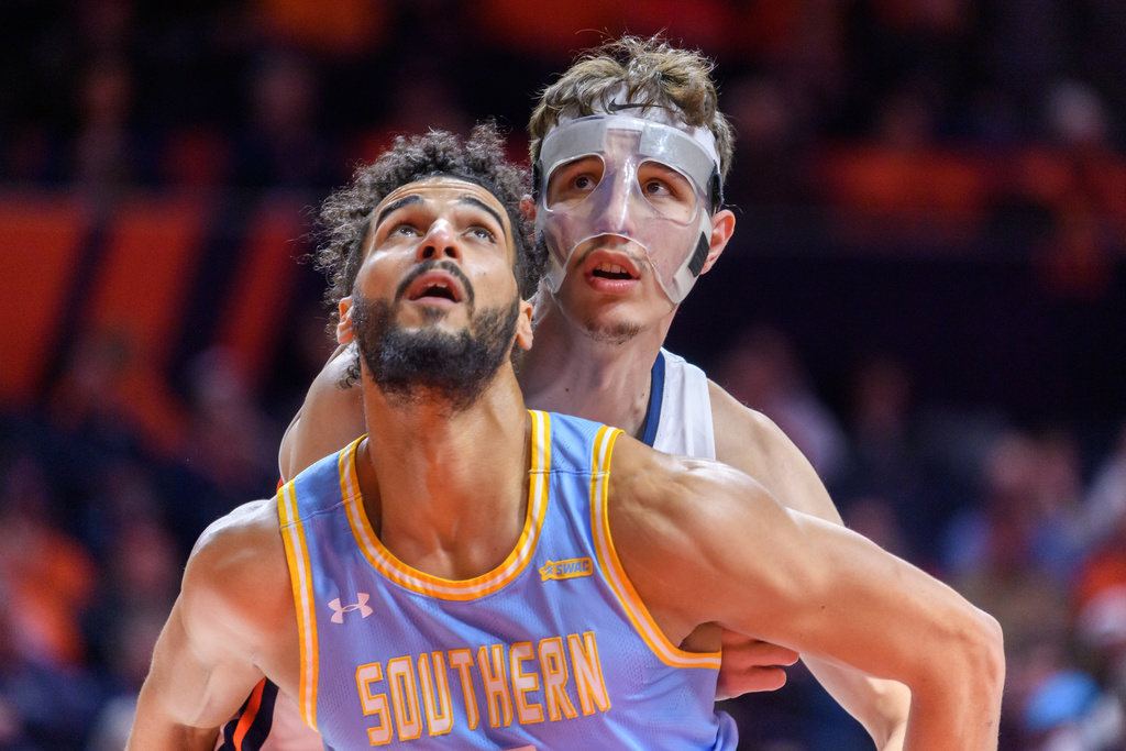 Southern University's Malek Abdelgowad fights for position against Illinois' Zvonimir Ivisic during the first half of an NCAA college basketball game Monday, Dec. 29, 2025, in Champaign, Ill. (AP Photo/Craig Pessman)