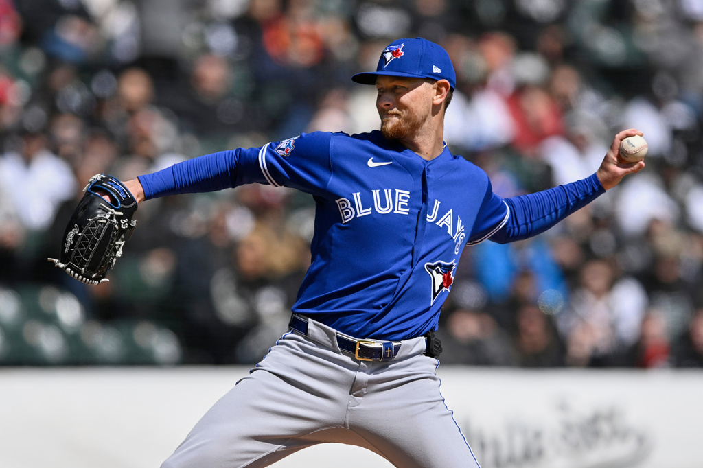 Toronto Blue Jays starter Eric Lauer delivers a pitch during the first inning of a baseball game against the Chicago White Sox in Chicago, Sunday, April 5, 2026. (AP Photo/Paul Beaty)