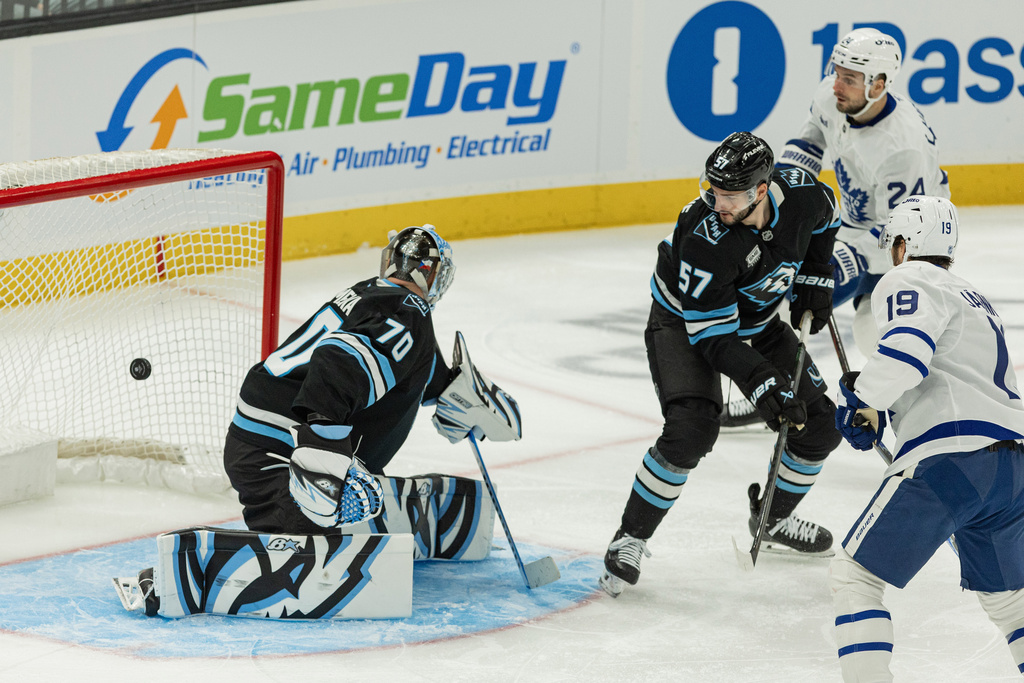 Toronto Maple Leafs center Calle Jarnkrok (19) scores against Utah Mammoth goaltender Karel Vejmelka (70) during the third period of an NHL hockey game Tuesday, Jan. 13, 2026, in Salt Lake City. (AP Photo/Melissa Majchrzak)