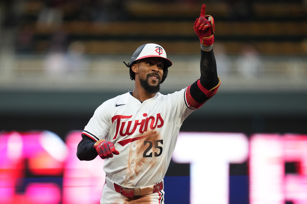Minnesota Twins' Byron Buxton (25) runs the bases after hitting a solo home run during the third inning of a baseball game against the Boston Red Sox Tuesday, April 14, 2026, in Minneapolis. (AP Photo/Abbie Parr)