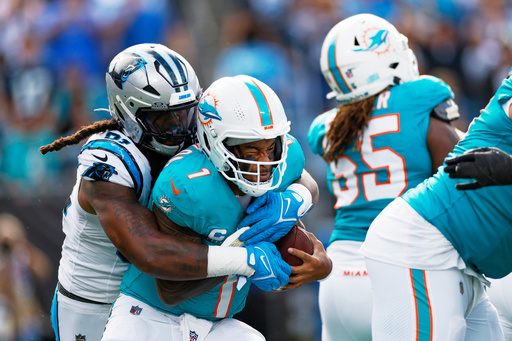 Miami Dolphins quarterback Tua Tagovailoa is sacked by Carolina Panthers linebacker Patrick Jones II during the second half of an NFL football game, Sunday, Oct. 5, 2025, in Charlotte, N.C. (AP Photo/Rusty Jones) Miami Dolphins quarterback Tua Tagovailoa is sacked by Carolina Panthers linebacker Patrick Jones II during the second half of an NFL football game, Sunday, Oct. 5, 2025, in Charlotte, N.C. (AP Photo/Rusty Jones)