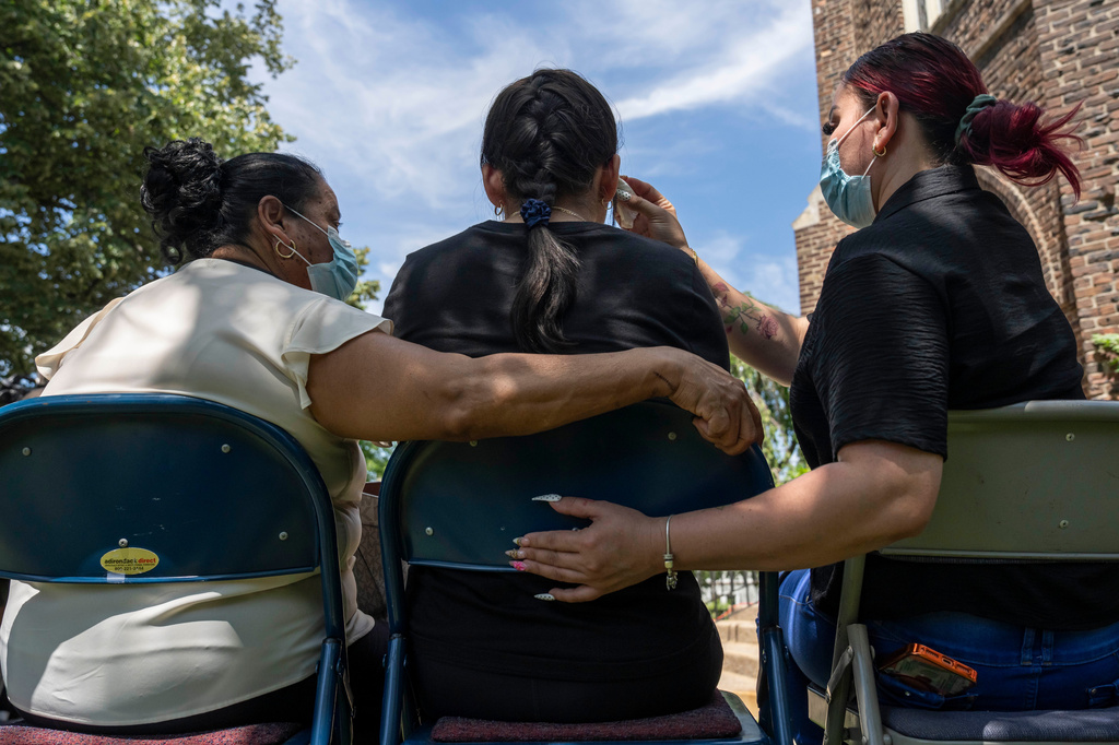 Family members of Edwin Lopez-Cornejo including his former wife, right; daughter, Ashley, center, and mother, Maria Cornejo, attend a news conference, Tuesday, Aug. 4, 2026, in Highland Park, N.J. (AP Photo/Yuki Iwamura)