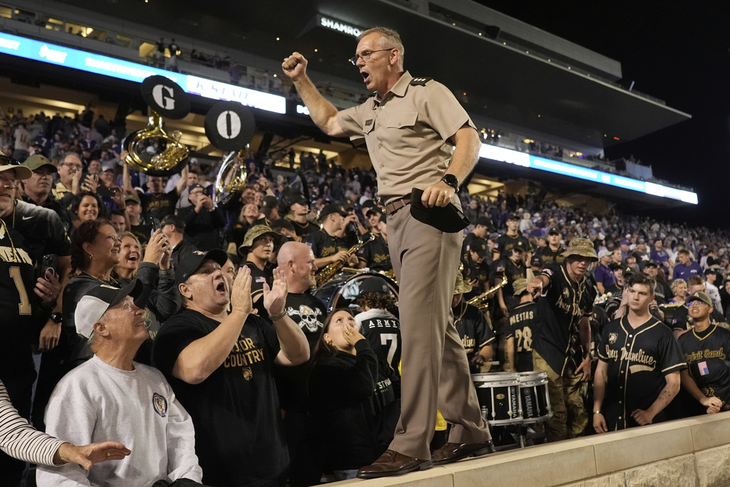 Westpoint commandant Lieutenant General Steven W. Gilland cheers after Army beat Kansas State in an NCAA college football game Saturday, Sept. 6, 2025, in Manhattan, Kan. (AP Photo/Charlie Riedel)