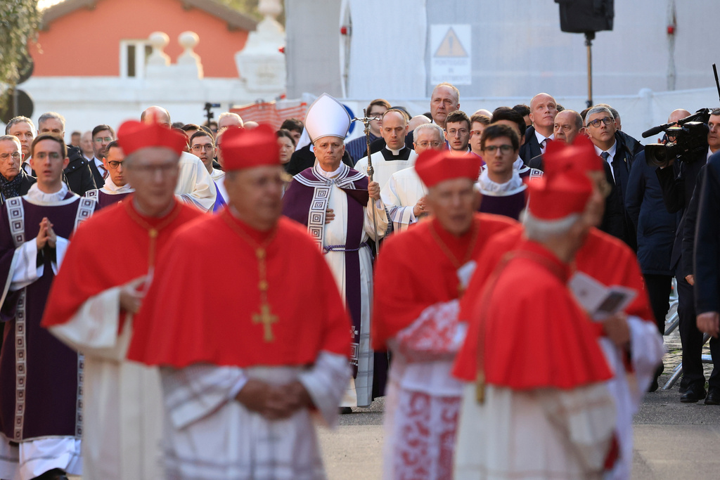 Pope Leo XIV arrives, with bishops and cardinals in a penitential procession marking the start of the Catholic Lent, at the Basilica of Santa Sabina in Rome, Wednesday, Feb. 18, 2026, where he will preside over Ash Wednesday Mass. (AP Photo/Riccardo De Luca)