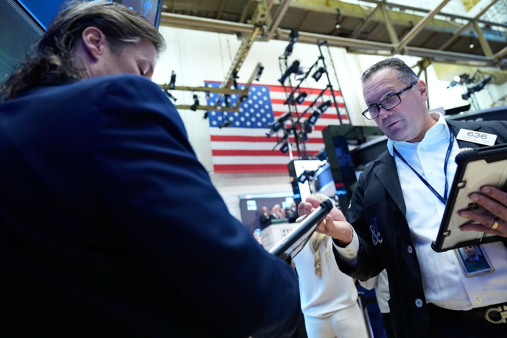 Edward Curran, right, works on the floor at the New York Stock Exchange in New York, Monday, Sept. 14, 2026. (AP Photo/Seth Wenig)