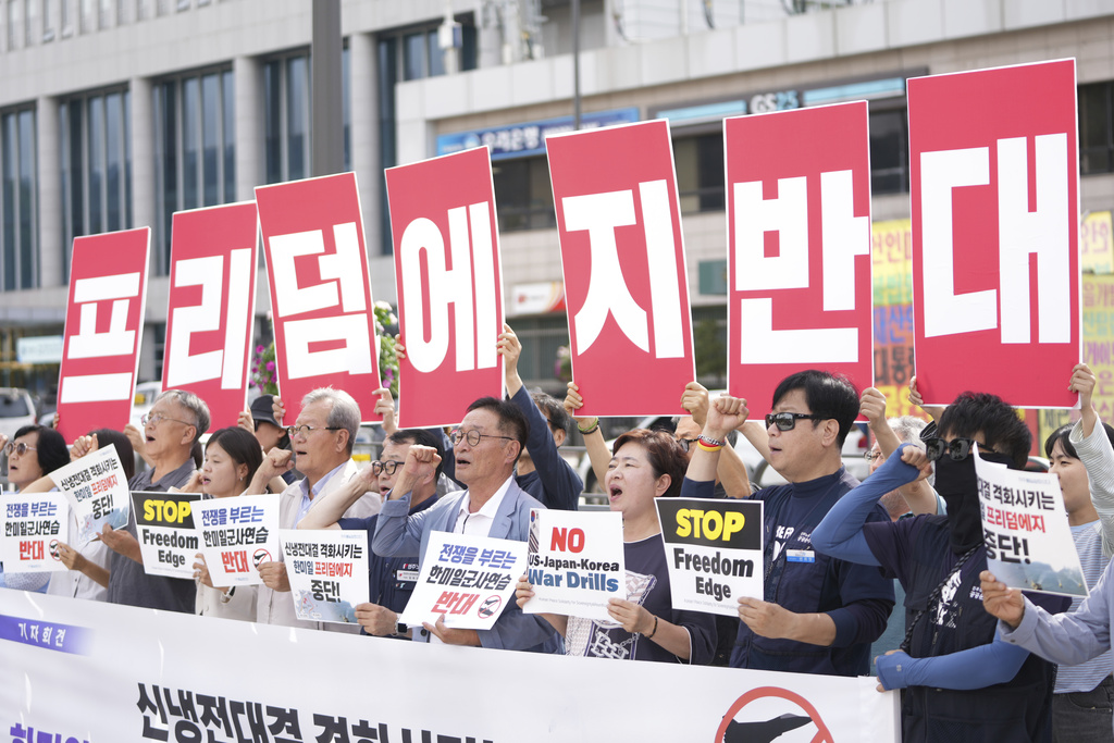 Protesters shout slogans during a press conference to oppose the military exercise called Freedom Edge in Seoul, South Korea, Monday, Sept. 15, 2025. A banner reads "Oppose Freedom Edge." (AP Photo/Lee Jin-man)