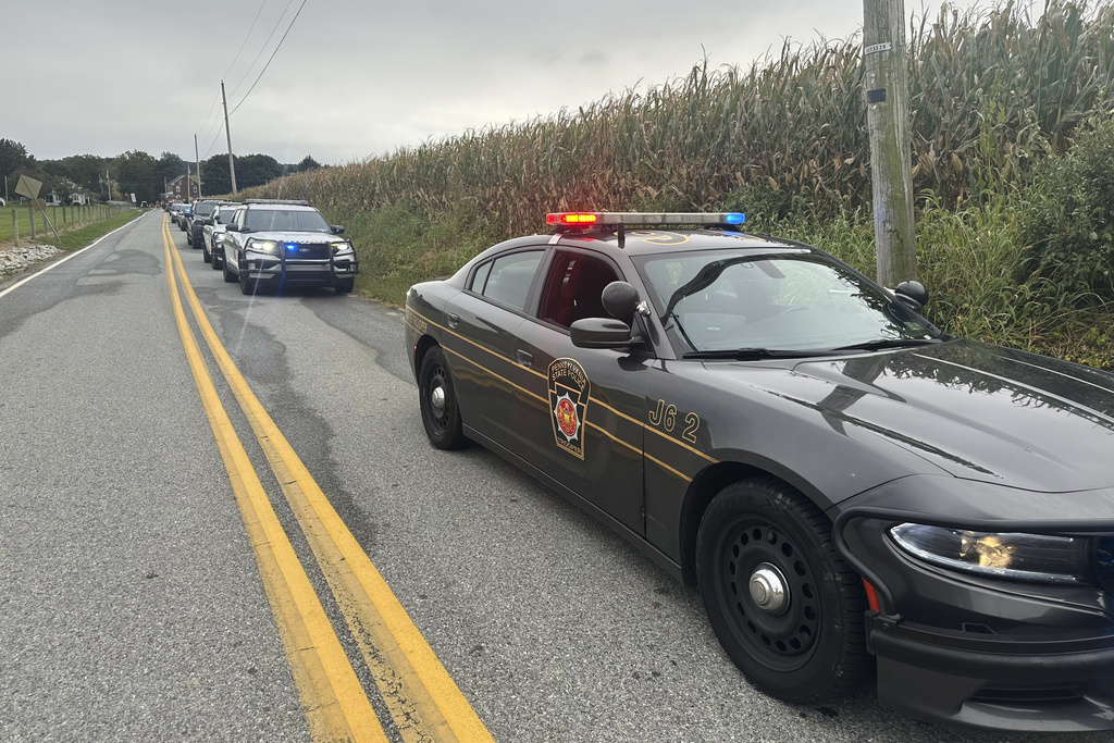 Police cordon off the area around a shooting involving police officers in North Codorus, Pa., on Wednesday, Sept. 17, 2025. (AP Photo/Mark Scolforo)