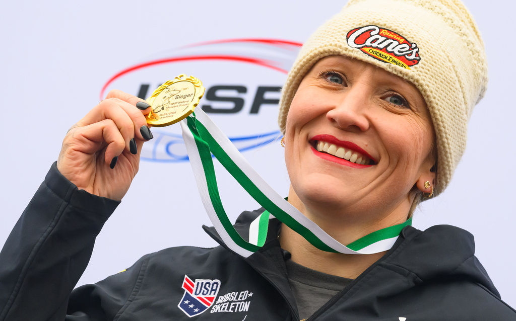 Winner Kaillie Armbruster Humphries of the U.S. celebrates her victory in the monobob, women, 2nd run, competition of the Bobsleigh World Cup, in Altenberg, Germany, Saturday Jan. 17, 2026. (Robert Michael/dpa via AP)