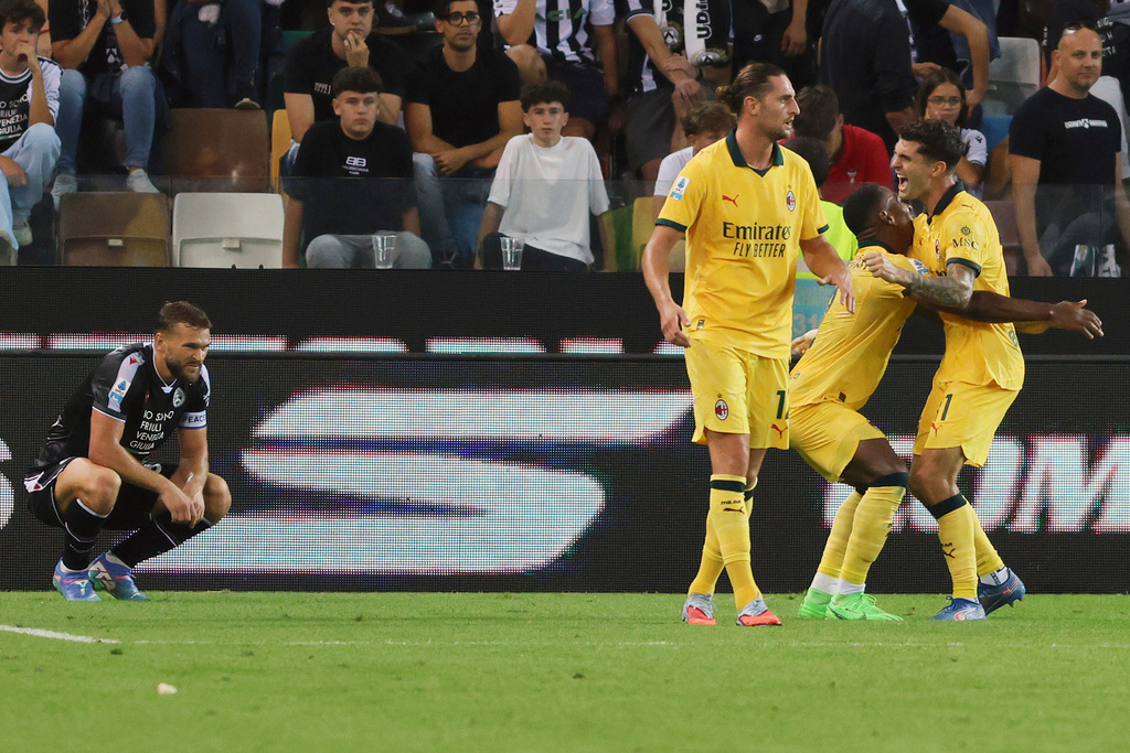 AC Milan's Christian Pulisic, right, celebrates with teammates after scoring a goal during the Serie A soccer match between Udinese and AC Milan at the Bluenergy Stadium in Udine, Italy, Saturday, Sept. 20, 2025. (Andrea Bressanutti/LaPresse via AP)