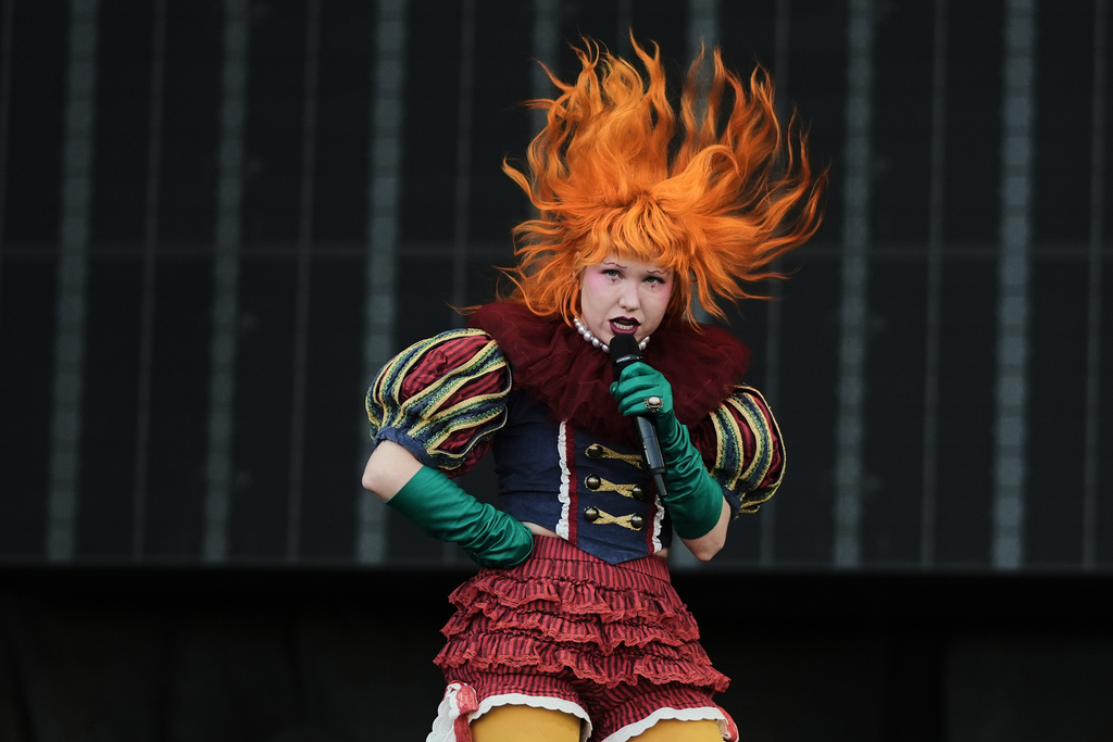 Michelle Buzz, singer of the U.S. band Haute & Freddy, performs during the Corona Capital music festival in Mexico City, Saturday, Nov. 15, 2025. (AP Photo/Claudia Rosel)
