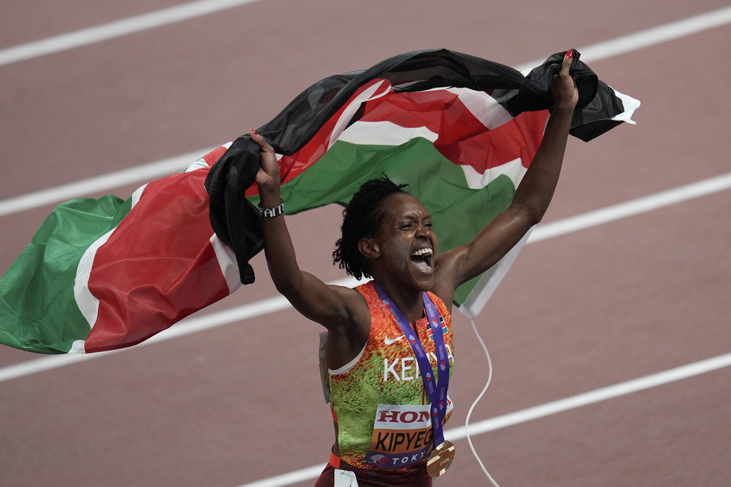 Kenya's Faith Kipyegon celebrates after competing the women's 1,500 meters final at the World Athletics Championships in Tokyo, Tuesday, Sept. 16, 2025. (AP Photo/Abbie Parr)