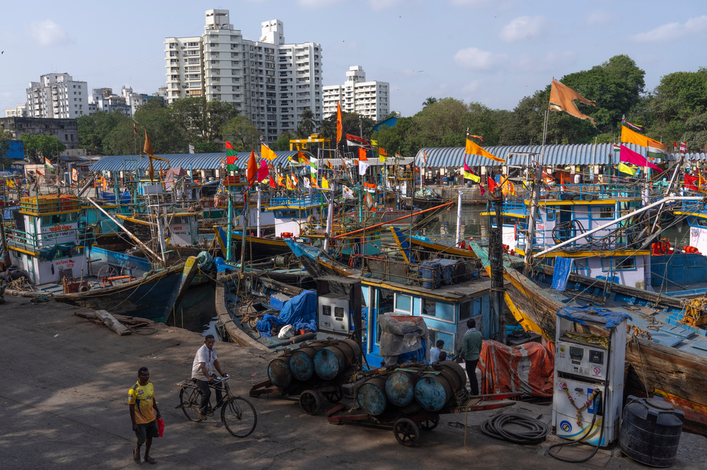 Fishing boats remain anchored at Sassoon Dock beside a cooperative diesel pump that is shut due to rising bulk fuel prices in Mumbai, India, Tuesday, April 7, 2026. (AP Photo/Rafiq Maqbool)