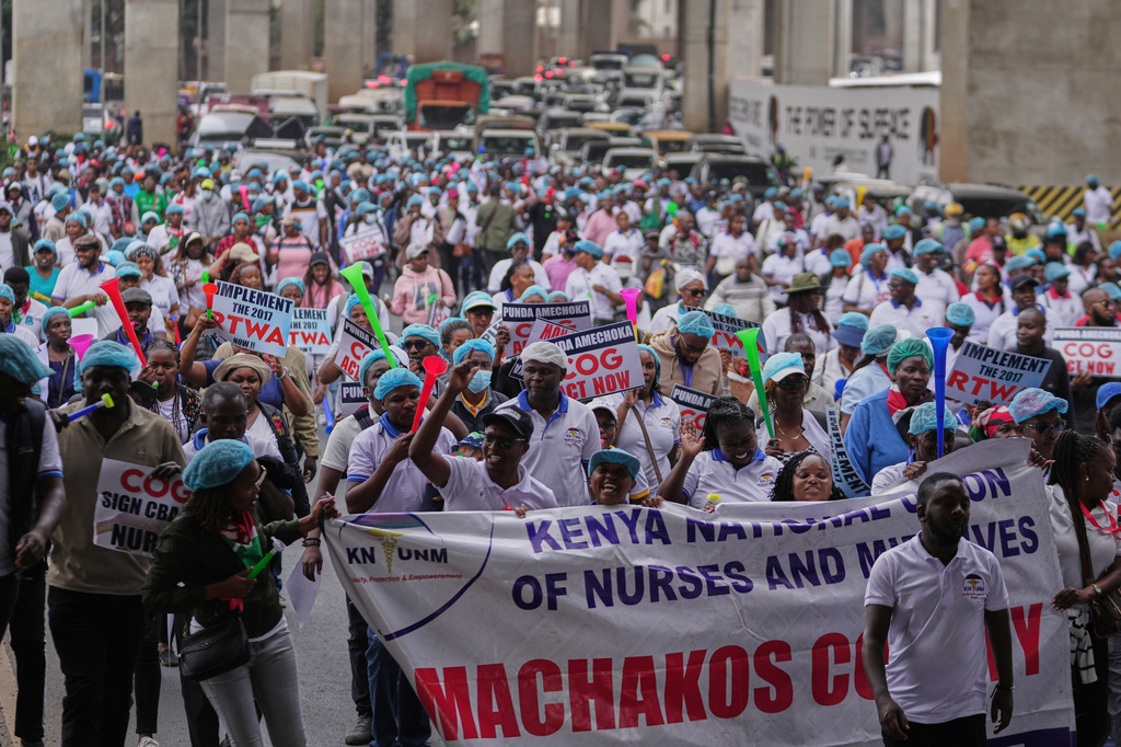 Kenyan nurses and other health workers demonstrate over low pay in Nairobi, Kenya Tuesday, Sept. 8, 2026. (AP Photo/Brian Inganga)