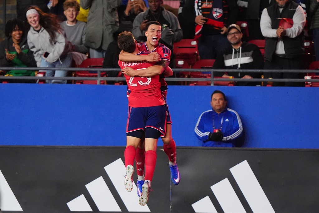 FC Dallas forward Logan Farrington (23) celebrates after his goal with teammate forward Petar Musa, center right, during the first half of an MLS soccer match against Toronto FC in Frisco, Texas, Saturday, Feb. 21, 2026. (AP Photo/LM Otero)
