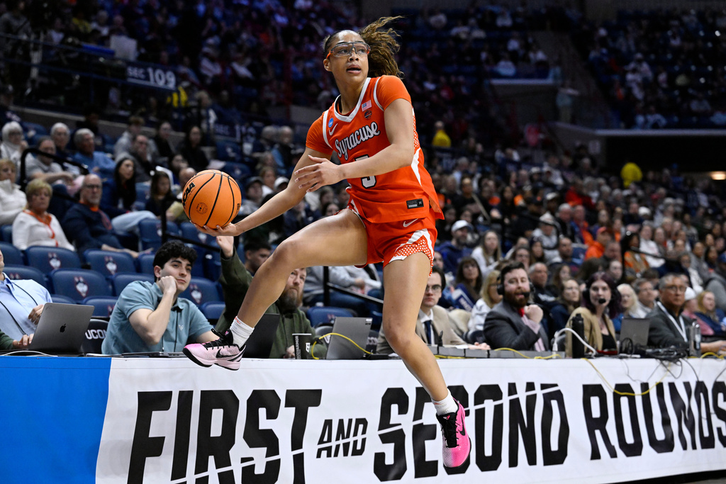 Syracuse guard Laila Phelia (5) keeps the ball inbounds during the first half against Iowa State in the first round of the NCAA college basketball tournament, Saturday, March 21, 2026, in Storrs, Conn. (AP Photo/Jessica Hill)
