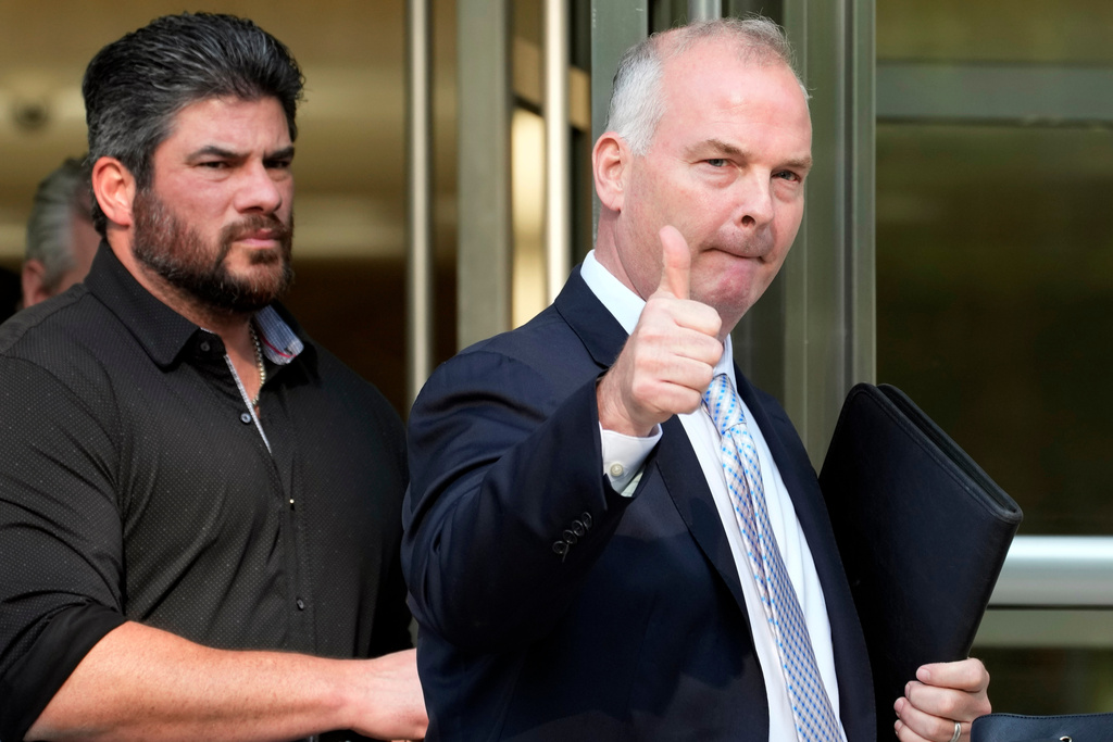 FILE - Michael McMahon, right, gives photographers a thumbs up as he leaves federal court, May 31, 2023, in the Brooklyn borough of New York. (AP Photo/Mary Altaffer, File)