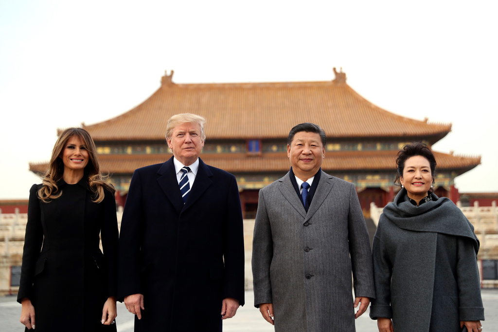 FILE - U.S. President Donald Trump, second left, first lady Melania Trump, left, Chinese President Xi Jinping and his wife Peng Liyuan stand together as they tour the Forbidden City in Beijing, Nov. 8, 2017. (AP Photo/Andrew Harnik, File)