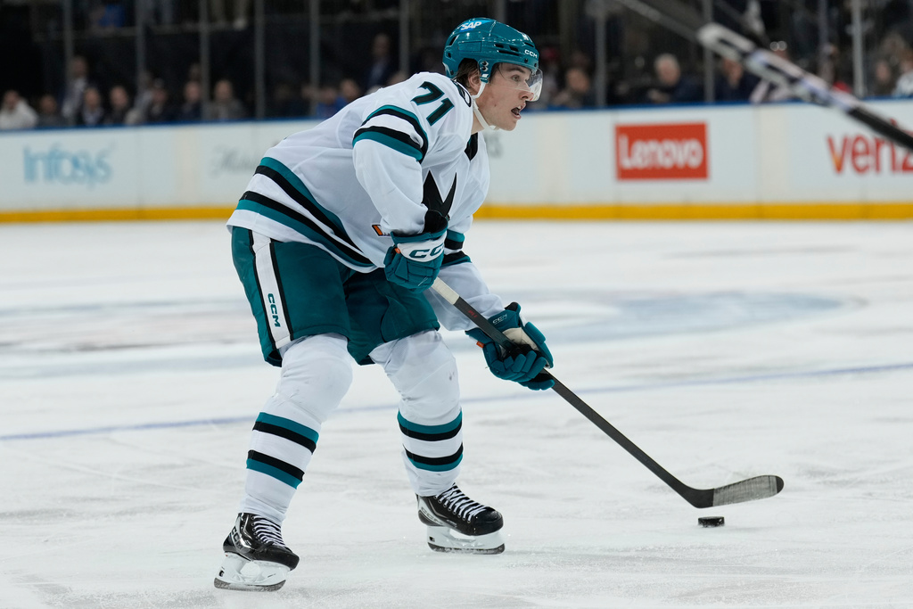 San Jose Sharks' Macklin Celebrini looks to shoot during the third period of an NHL hockey game against the New York Rangers in New York, Thursday, Oct. 23, 2025. (AP Photo/Seth Wenig)