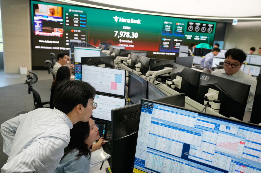 Currency traders work at the foreign exchange dealing room of the Hana Bank headquarters in Seoul, South Korea, Thursday, May 14, 2026. (AP Photo/Ahn Young-joon)