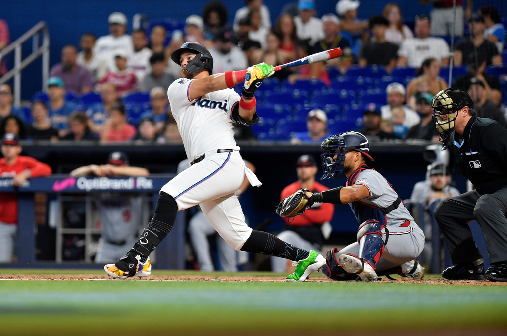 Miami Marlins' Heriberto Hernández hits a home run during the second inning of a baseball game against the Washington Nationals, Saturday, Aug. 22, 2026, in Miami. (AP Photo/Michael Laughlin)