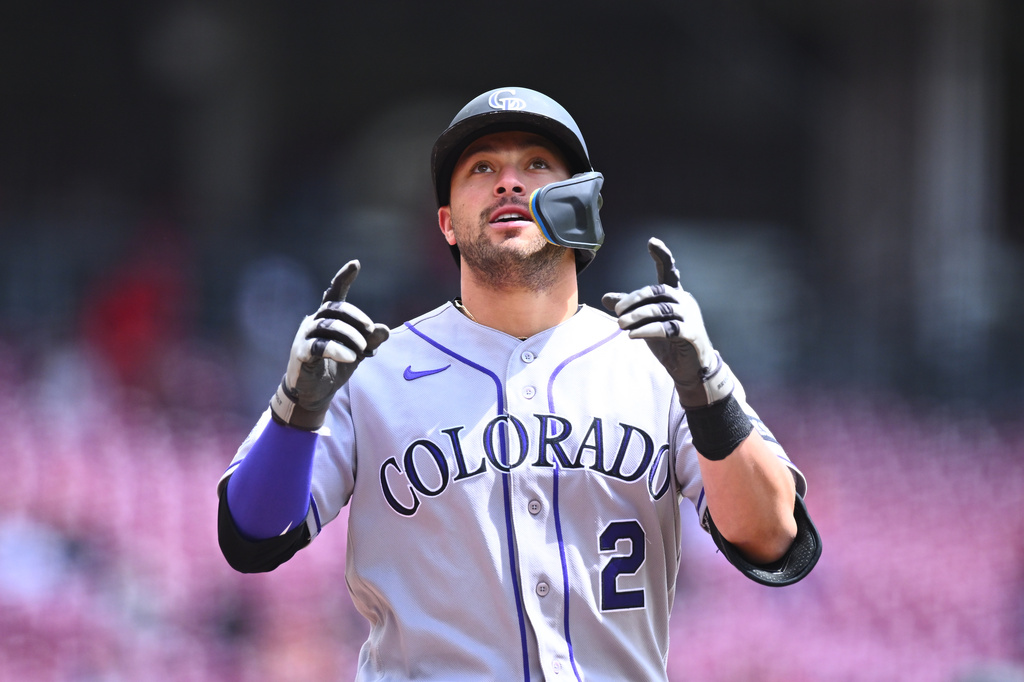 Colorado Rockies' Tyler Freeman (2) reacts after hitting a two-run home run during the first inning of a baseball game against the Cincinnati Reds in Cincinnati, Thursday, April 30, 2026. (AP Photo/Ben Jackson)