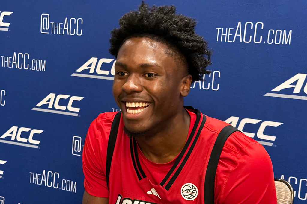 Louisville center Flory Bidunga speaks to reporters at the ACC TipOff on Tuesday, Oct. 6, 2026, in Charlotte, N.C. (AP Photo/Steve Reed)