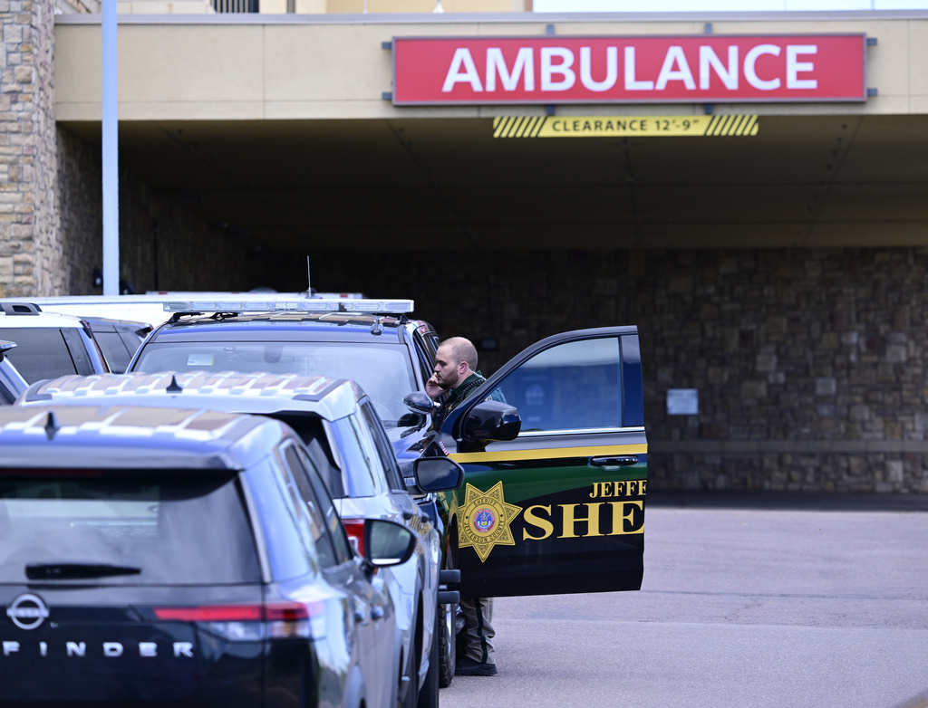 A Jefferson County, Colo., Sheriffs Department deputy is stationed outside of the St. Anthony's Hospital emergency entrance in Lakewood, Colo., on Wednesday, Sept. 10, 2025. (Andy Cross/The Denver Post via AP)