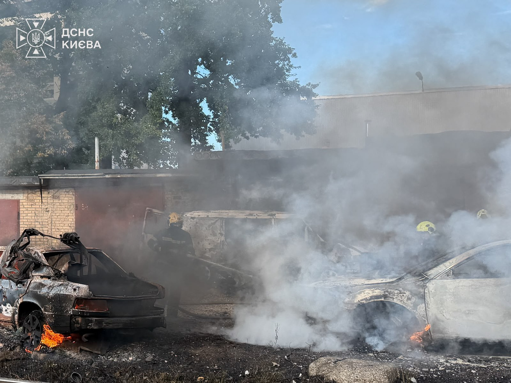 In this photo provided by the Ukrainian Emergency Service, firefighters put out a fire involving private vehicles following a Russian air attack in Kyiv, Ukraine, Wednesday, Sept. 16, 2026. (Ukrainian Emergency Service via AP)
