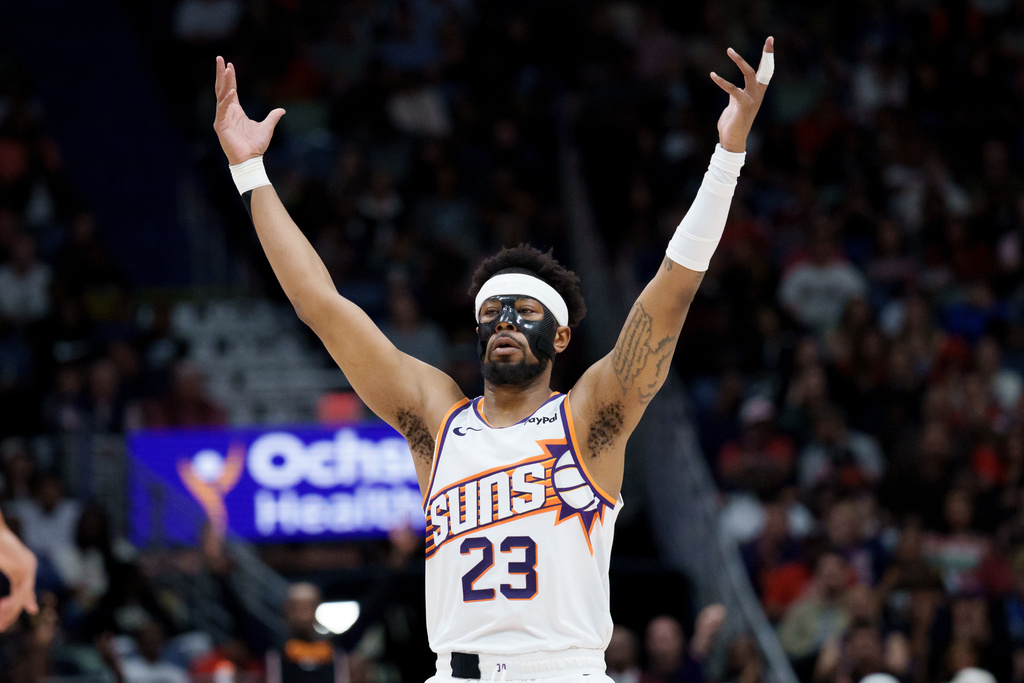 Phoenix Suns guard Jordan Goodwin reacts after a 3-point basket against the New Orleans Pelicans during the second half of an NBA basketball game in New Orleans, Saturday, Dec. 27, 2025. (AP Photo/Matthew Hinton)