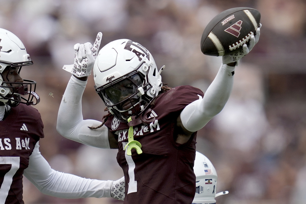 Texas A&M wide receiver Mario Craver (1) reacts after a first down catch and run against Utah State during the second half of an NCAA college football game Saturday, Sept. 6, 2025, in College Station, Texas. (AP Photo/Sam Craft)