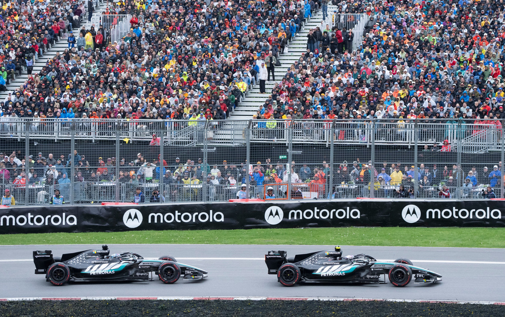 Mercedes driver Kimi Antonelli, right, of Italy, leads teammate Mercedes driver George Russell, of Britain, during the F1 Canadian Grand Prix auto race in Montreal, Sunday, May 24, 2026. (Christinne Muschi/The Canadian Press via AP)