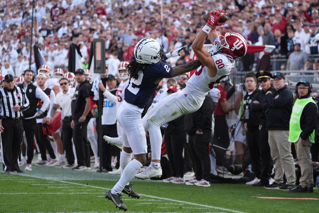Indiana wide receiver Charlie Becker (80) catches a pass over Penn State cornerback Audavion Collins (2) during an NCAA college football game, Saturday, Nov. 8, 2025, in State College, Pa. (AP Photo/Sam Balkansky)