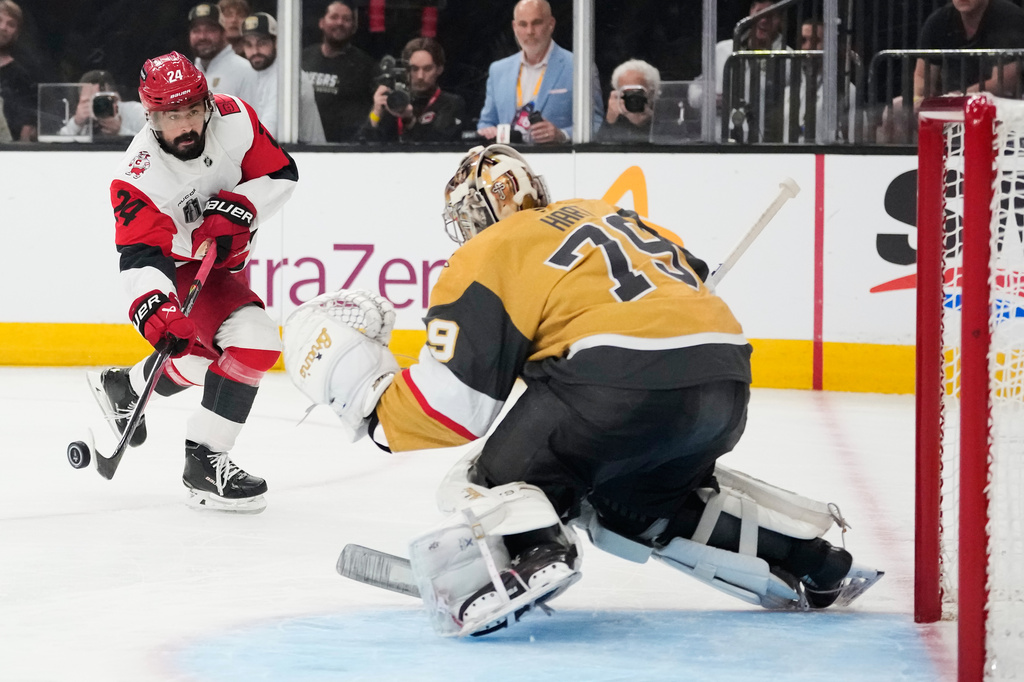 FILE - Carolina Hurricanes right wing Seth Jarvis (24) shoots in front of Vegas Golden Knights goaltender Carter Hart (79) during the third period in Game 6 of the NHL hockey Stanley Cup Final series, Sunday, June 14, 2026, in Las Vegas. (AP Photo/John Locher, File)