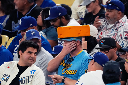 Fans watch during the fifth inning in Game 4 of baseball's National League Championship Series between the Milwaukee Brewers and the Los Angeles Dodgers, Friday, Oct. 17, 2025, in Los Angeles. (AP Photo/Mark J. Terrill) Fans watch during the fifth inning in Game 4 of baseball's National League Championship Series between the Milwaukee Brewers and the Los Angeles Dodgers, Friday, Oct. 17, 2025, in Los Angeles. (AP Photo/Mark J. Terrill)