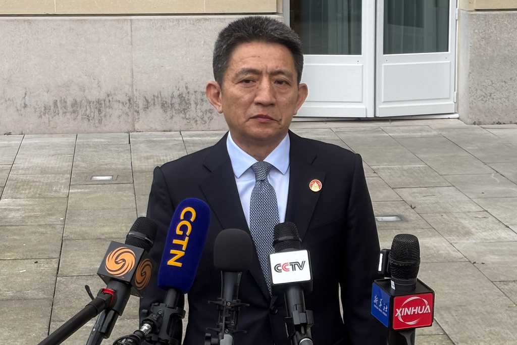 Chinese lead trade negotiator Li Chenggang gives a press conference at the Organization for Economic Cooperation and Development headquarters, Monday, March 16, 2026, in Paris, France. (AP Photo/Oleg Cetinic)